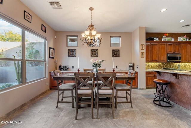 dining area with a chandelier