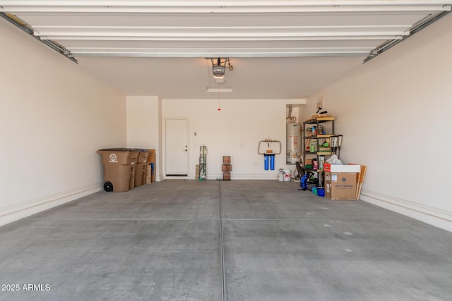 815 E Laddoos Ave, San Tan Valley, AZ 85140 - garage with a garage door opener, gas water heater, and baseboards