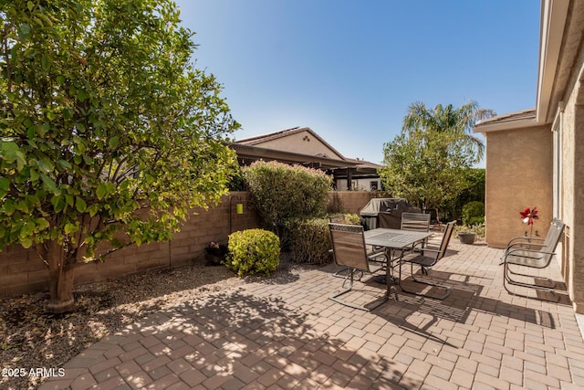 815 E Laddoos Ave, San Tan Valley, AZ 85140 - view of patio / terrace with a fenced backyard, outdoor dining area, and area for grilling
