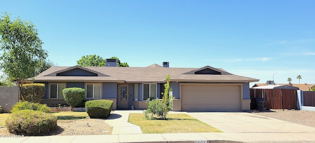 5539 E Dragoon Ave, Mesa, AZ 85206 - ranch-style house featuring brick siding, concrete driveway, a garage, and a shingled roof