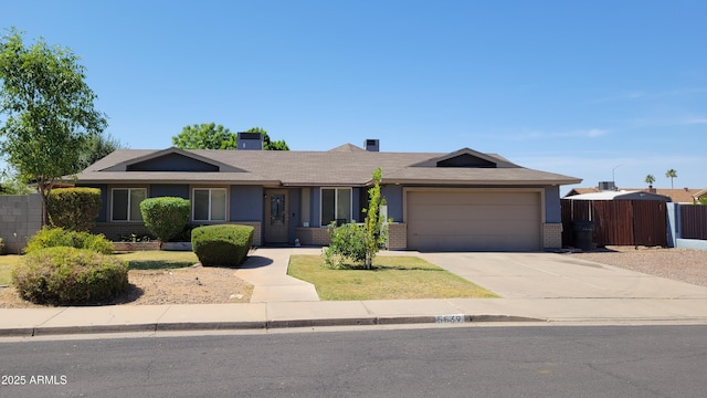 5539 E Dragoon Ave, Mesa, AZ 85206 - ranch-style home with a garage, concrete driveway, brick siding, and roof with shingles
