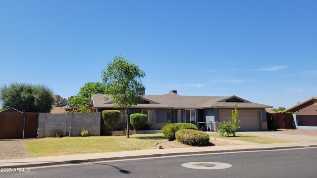 5539 E Dragoon Ave, Mesa, AZ 85206 - ranch-style home featuring a garage and concrete driveway