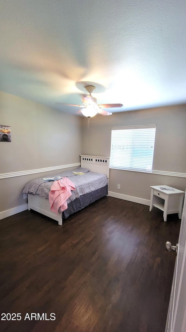 5539 E Dragoon Ave, Mesa, AZ 85206 - bedroom featuring dark wood-type flooring and a ceiling fan