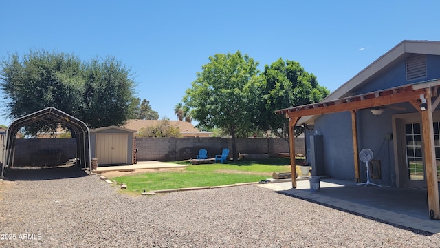 5539 E Dragoon Ave, Mesa, AZ 85206 - fenced backyard featuring a storage shed, a patio area, and a detached carport