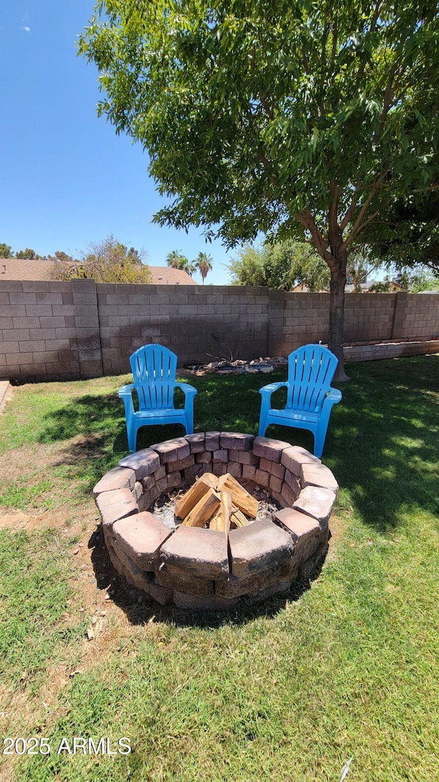 5539 E Dragoon Ave, Mesa, AZ 85206 - fenced backyard with a fire pit