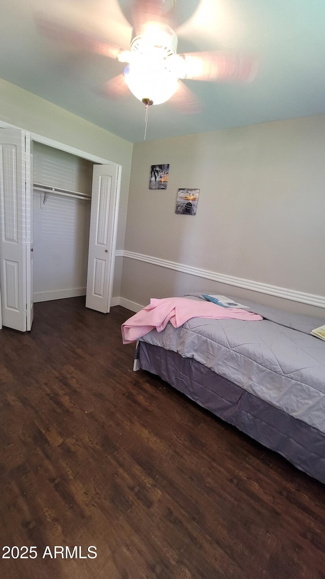 5539 E Dragoon Ave, Mesa, AZ 85206 - bedroom featuring wood finished floors, a closet, and a ceiling fan