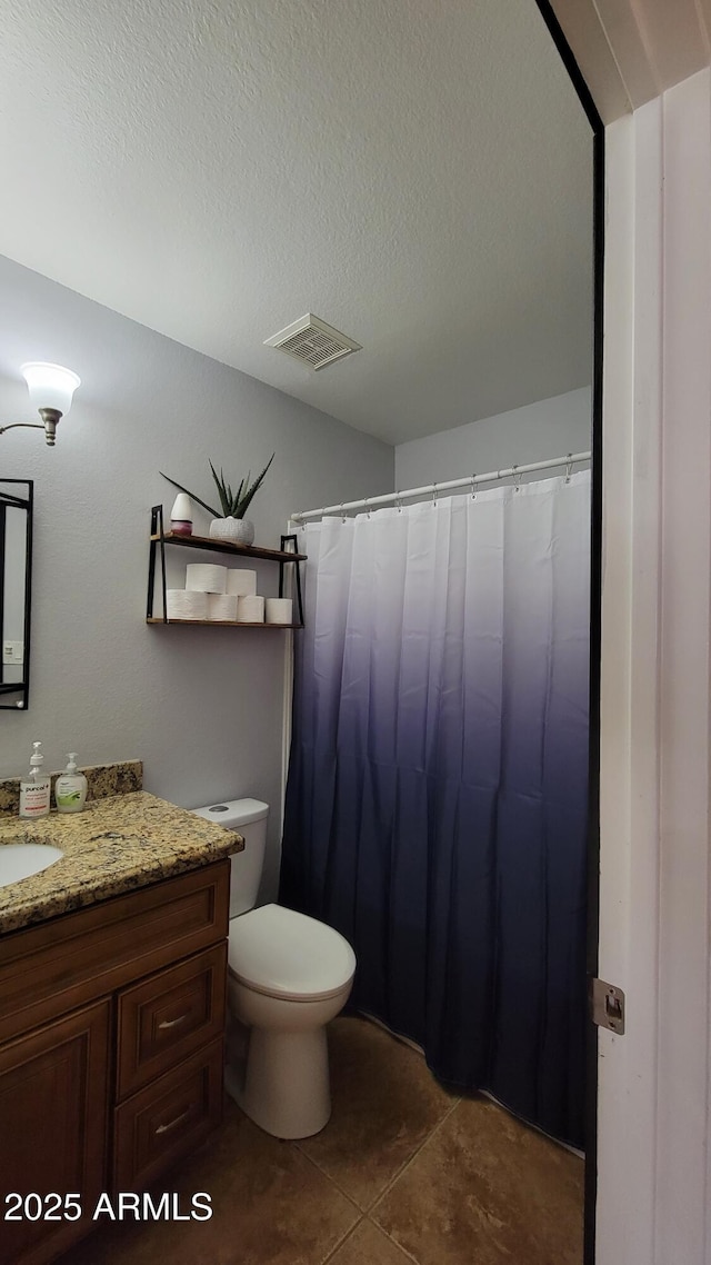 5539 E Dragoon Ave, Mesa, AZ 85206 - full bath with vanity, tile patterned floors, and a textured ceiling