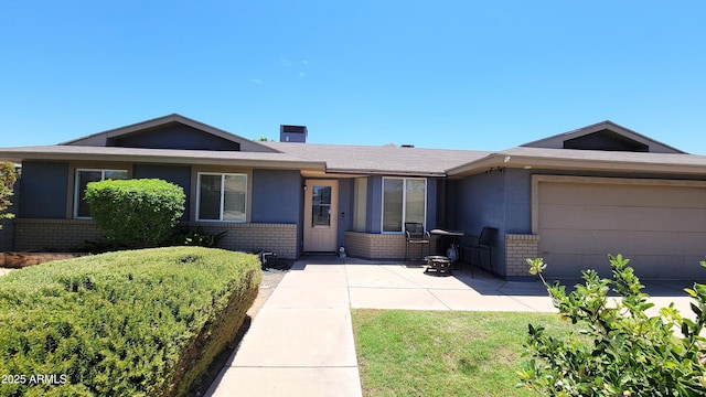 5539 E Dragoon Ave, Mesa, AZ 85206 - ranch-style house featuring brick siding and an attached garage