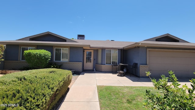 5539 E Dragoon Ave, Mesa, AZ 85206 - ranch-style home with brick siding and an attached garage