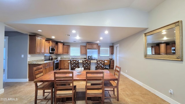 5539 E Dragoon Ave, Mesa, AZ 85206 - dining space with vaulted ceiling, recessed lighting, and light tile patterned floors