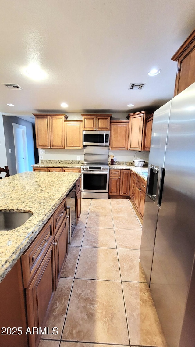 5539 E Dragoon Ave, Mesa, AZ 85206 - kitchen featuring stainless steel appliances, light stone counters, wine cooler, light tile patterned floors, and recessed lighting