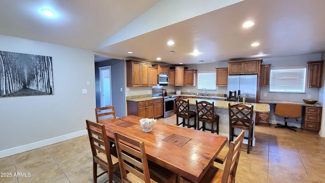 5539 E Dragoon Ave, Mesa, AZ 85206 - dining area with light tile patterned floors, recessed lighting, and vaulted ceiling