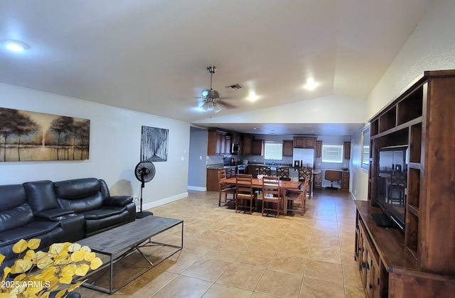 5539 E Dragoon Ave, Mesa, AZ 85206 - living area with ceiling fan, light tile patterned flooring, and vaulted ceiling