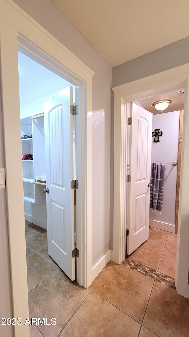 5539 E Dragoon Ave, Mesa, AZ 85206 - hall with baseboards and light tile patterned floors