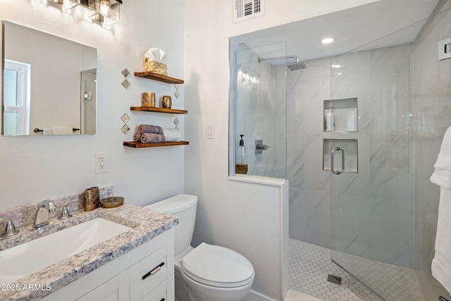 7707 E Earll Dr, Scottsdale, AZ 85251 - bathroom featuring a marble finish shower, toilet, and vanity
