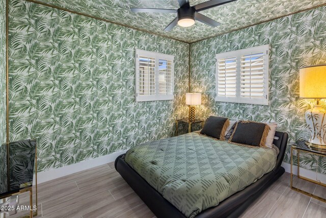 7707 E Earll Dr, Scottsdale, AZ 85251 - bedroom featuring wallpapered walls, wood finished floors, baseboards, and a ceiling fan
