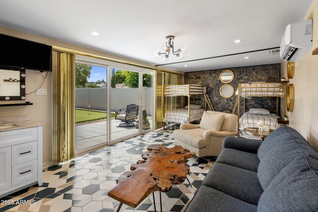 7707 E Earll Dr, Scottsdale, AZ 85251 - living area with a wall unit AC, a chandelier, and recessed lighting