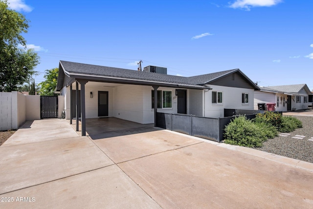 7707 E Earll Dr, Scottsdale, AZ 85251 - ranch-style home featuring a gate, driveway, a carport, cooling unit, and brick siding