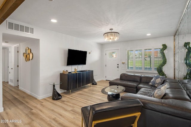 7707 E Earll Dr, Scottsdale, AZ 85251 - living area with light wood-type flooring, recessed lighting, baseboards, and a chandelier