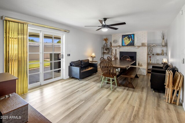 7707 E Earll Dr, Scottsdale, AZ 85251 - living area with a brick fireplace, wood finished floors, and ceiling fan