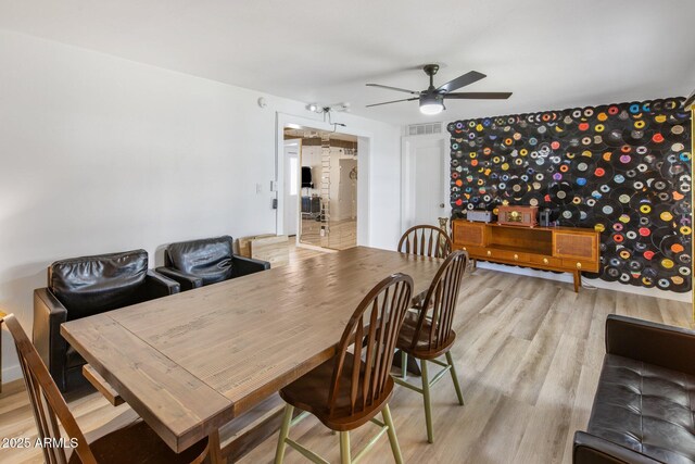 7707 E Earll Dr, Scottsdale, AZ 85251 - dining room featuring a ceiling fan and light wood finished floors