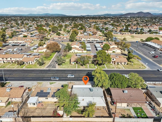 birds eye view of property featuring a mountain view