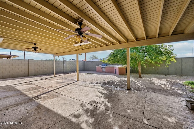 view of patio featuring area for grilling and ceiling fan