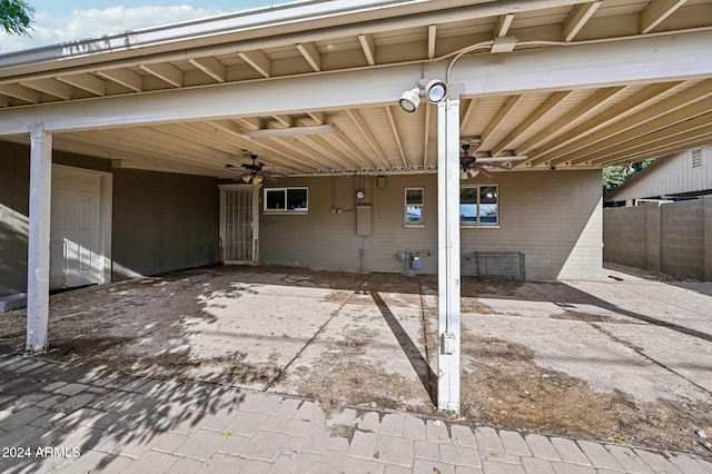 view of patio with ceiling fan and a carport