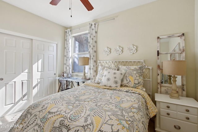 bedroom featuring ceiling fan and a closet