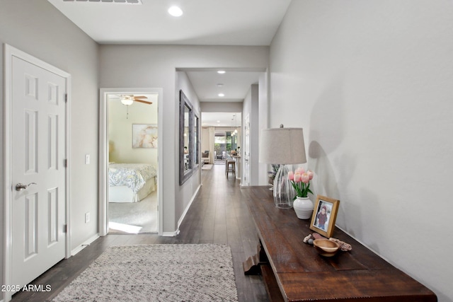 corridor featuring dark hardwood / wood-style flooring