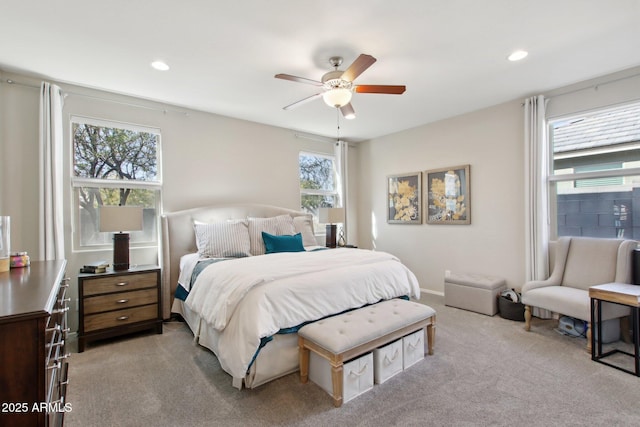 bedroom with light colored carpet and ceiling fan