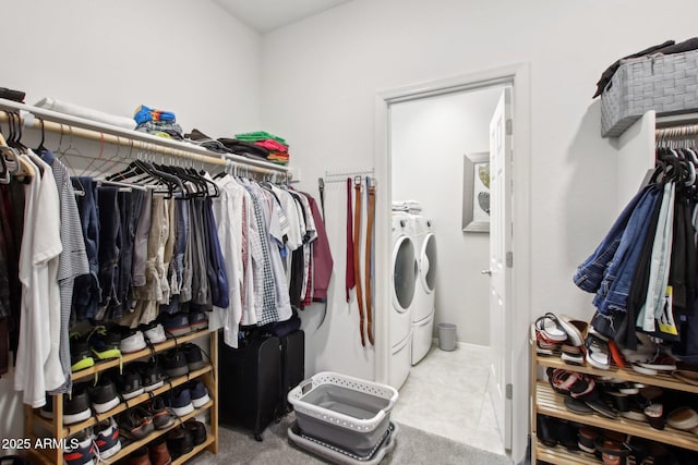 interior space featuring light tile patterned flooring and washer and dryer