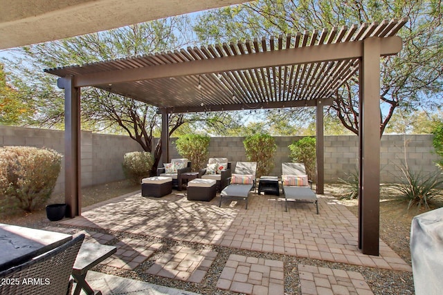 view of patio / terrace with an outdoor living space and a pergola