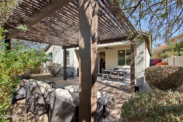 view of patio / terrace with ceiling fan and a pergola