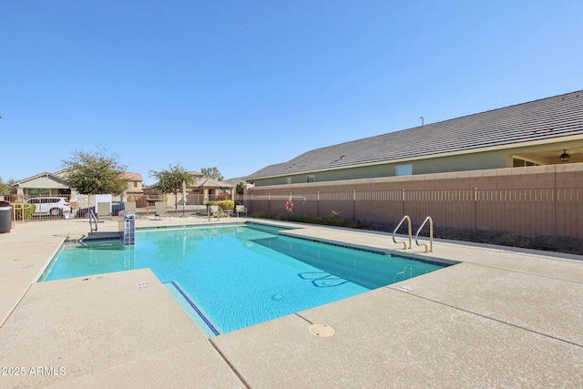 view of swimming pool featuring a patio area