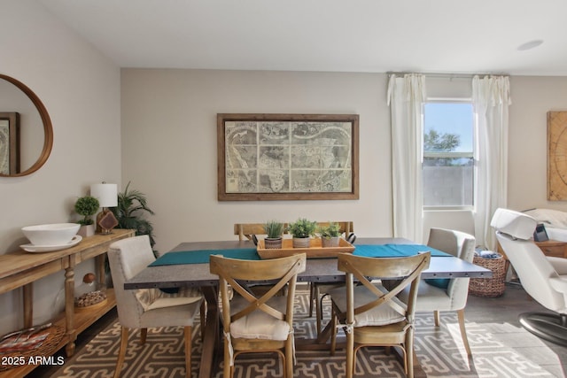 dining area with wood-type flooring