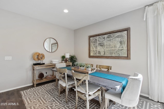 dining space featuring dark hardwood / wood-style floors