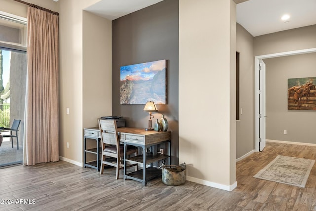 office with light hardwood / wood-style floors