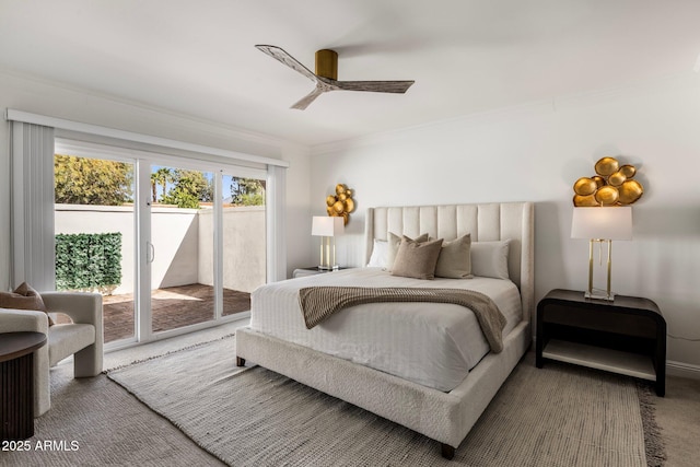 carpeted bedroom with crown molding, a ceiling fan, and access to outside