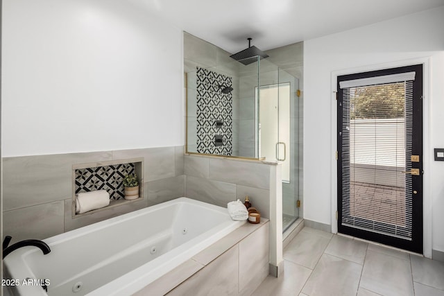 full bathroom with tile patterned flooring, a shower stall, and a whirlpool tub