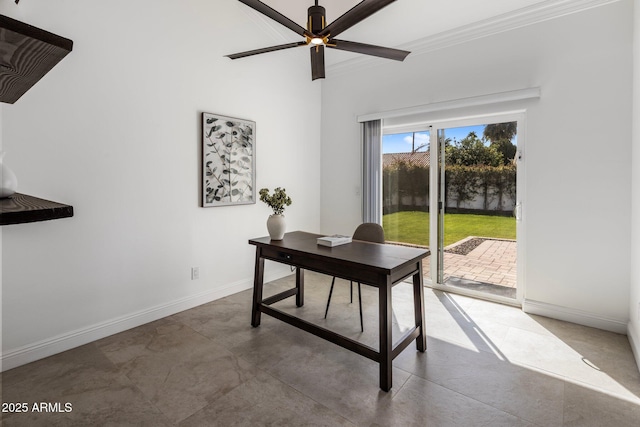 office space with crown molding, baseboards, concrete floors, and ceiling fan