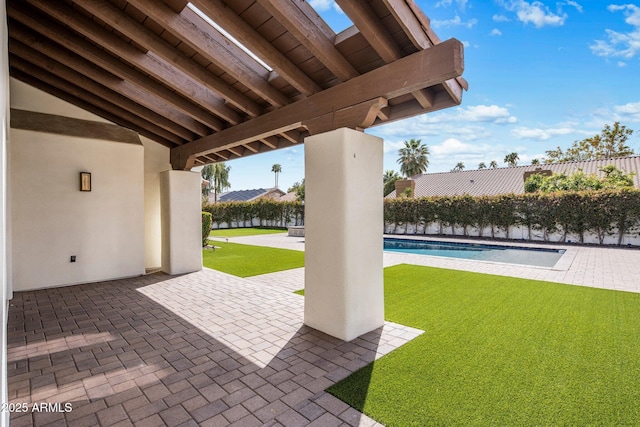 view of patio / terrace with a fenced in pool