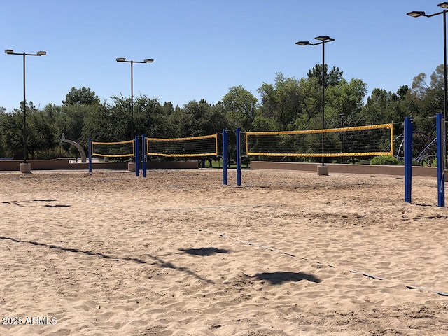 view of home's community featuring volleyball court