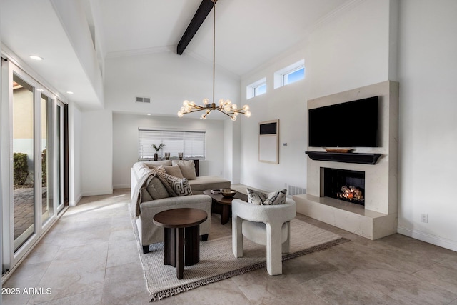 living area featuring visible vents, beam ceiling, an inviting chandelier, a fireplace, and baseboards