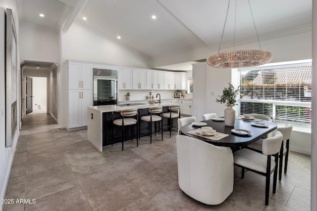 dining room featuring recessed lighting, high vaulted ceiling, and crown molding