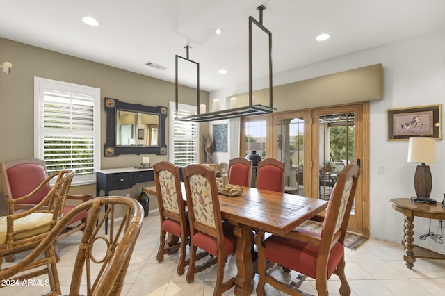 dining room with a healthy amount of sunlight and light tile patterned flooring