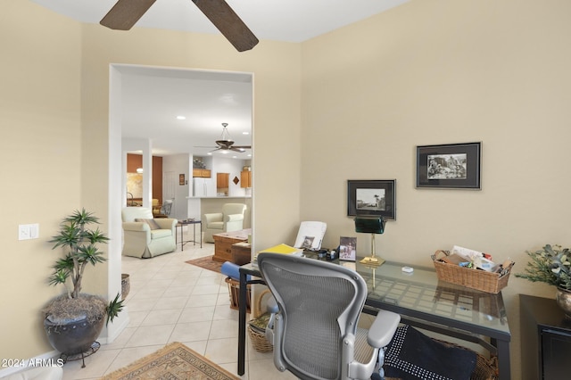 home office with light tile patterned floors and ceiling fan