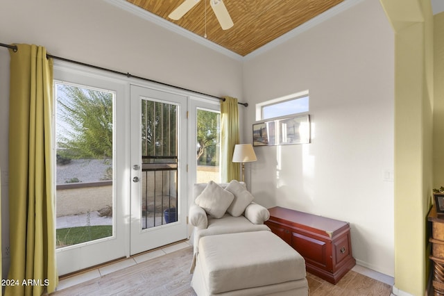 sitting room featuring wood ceiling, plenty of natural light, light hardwood / wood-style flooring, and ornamental molding