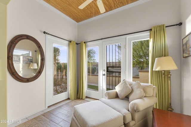 interior space with a wealth of natural light, ceiling fan, and wooden ceiling