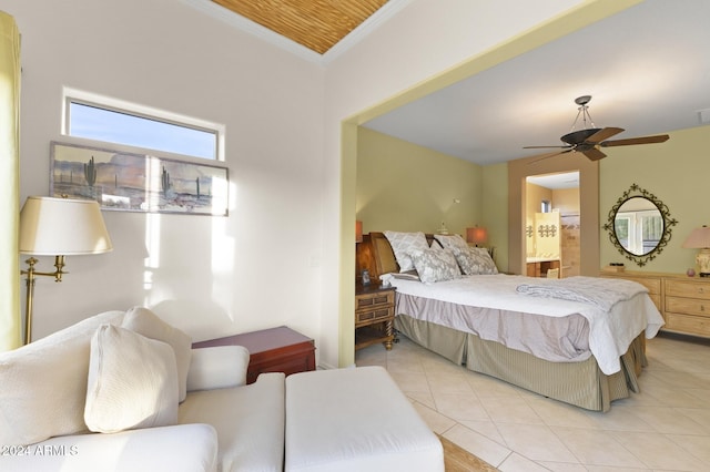 tiled bedroom with ceiling fan, connected bathroom, and crown molding